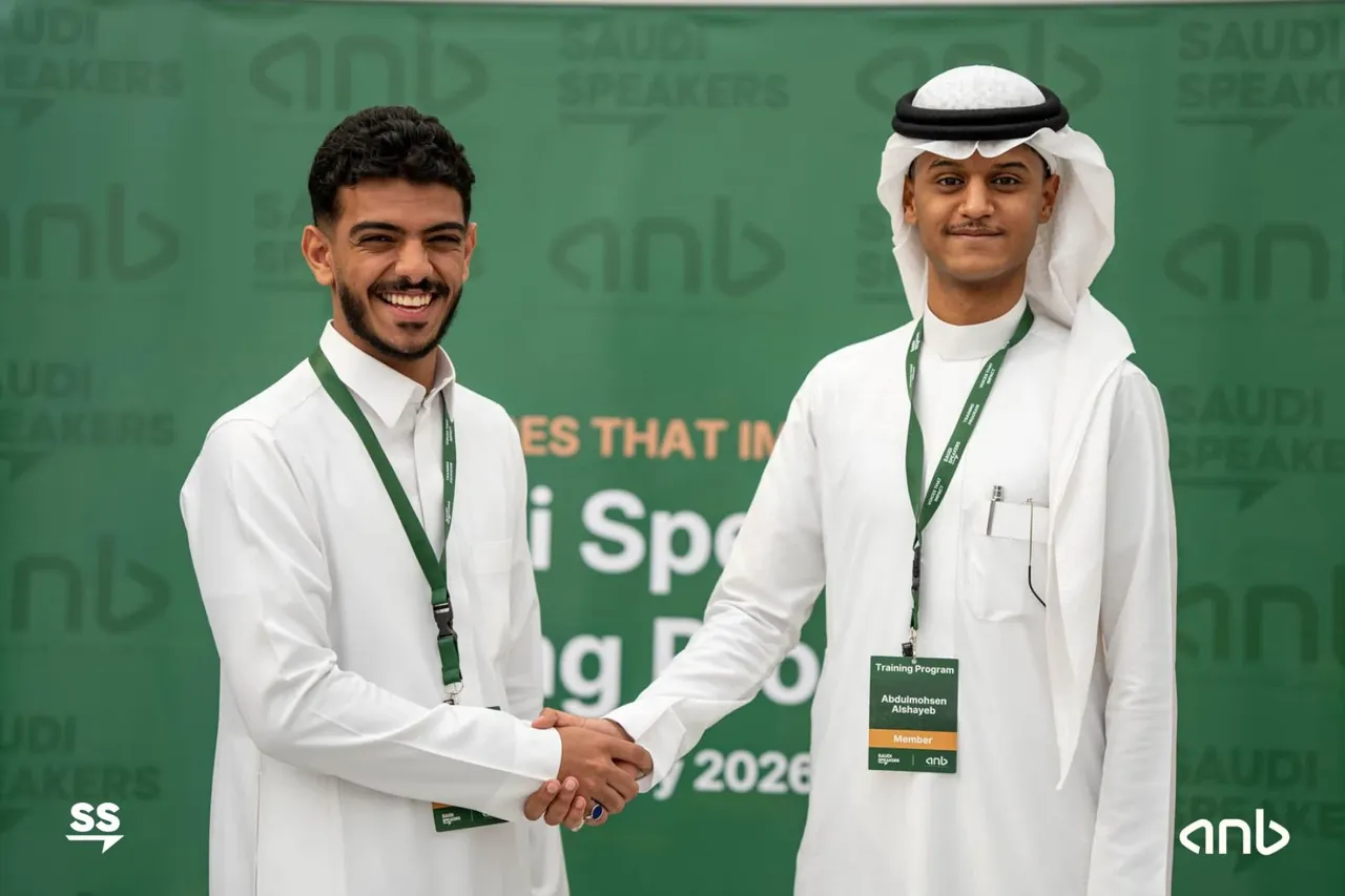 Saudi Speakers coach congratulating a training participant