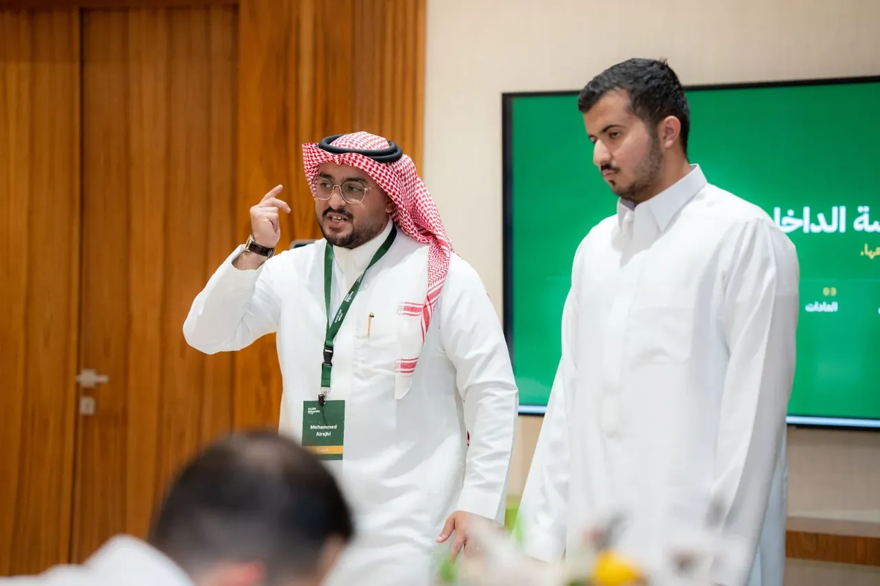 Coach guiding a participant during a communication workshop